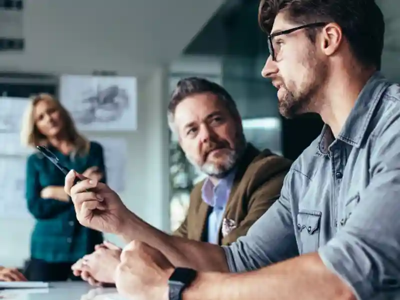 Business people discussing over new business project in office.