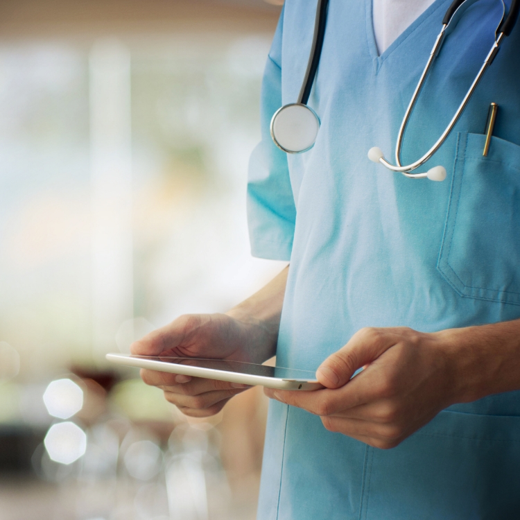 Doctor using a digital tablet