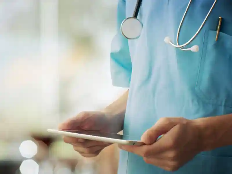 Doctor using a digital tablet